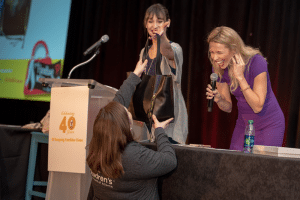 Woman winning a handbag